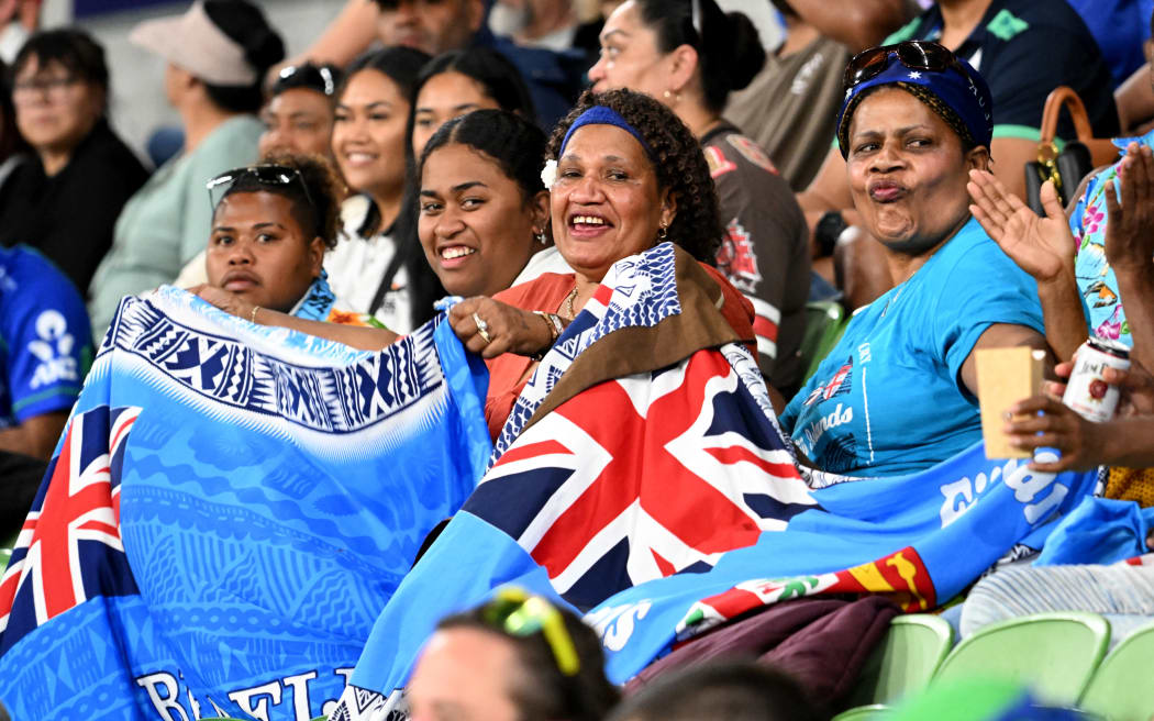 Fijian fans cheers for their team in the stands during the Super Rugby match between the NSW Waratahs and the Fijian Drua at the AAMI Park in Melbourne on March 4, 2023. (Photo by William WEST / AFP) / --IMAGE RESTRICTED TO EDITORIAL USE - STRICTLY NO COMMERCIAL USE--