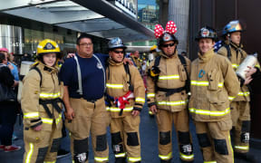 A group of firefighters from Whangaparaoa, near Auckland, prepare to tackle the Sky Tower climb.