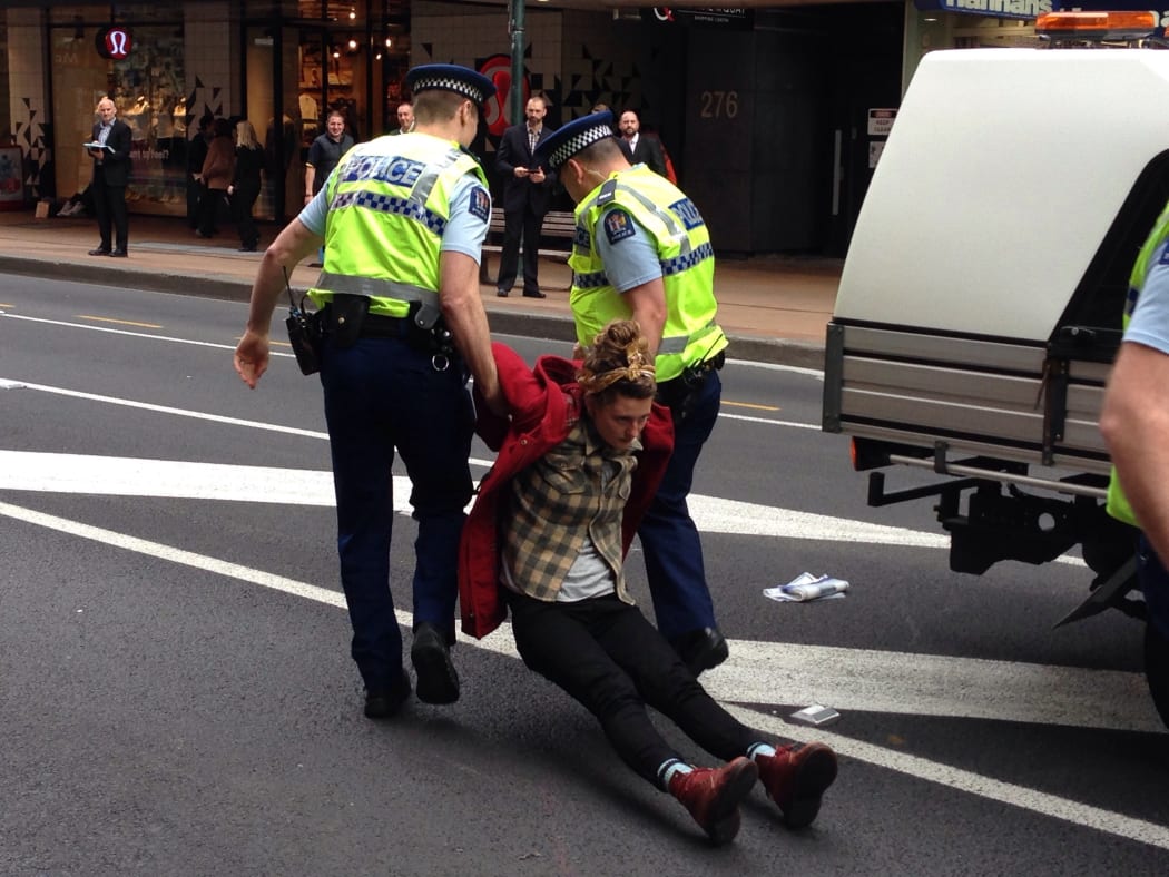 Police arrest protesters at the demonstration in Wellington
