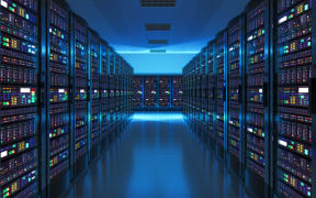 Data storage and cloud computing computer service business concept, showing a server room interior in a data centre.