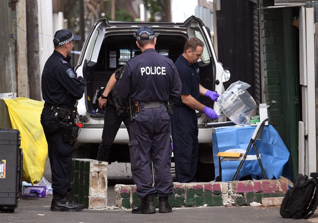 Police outside a house in Surry Hills, one of five raided in a counter-terror operation on Saturday.