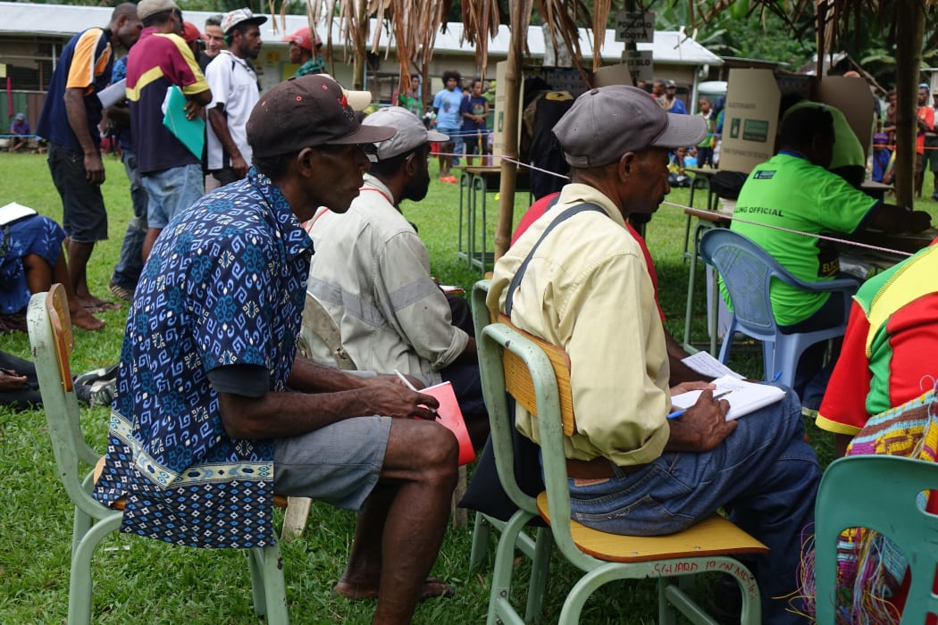 Scrutineers watch polling during the Papua New Guinea national election 2017.