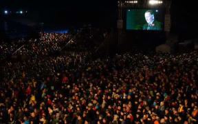 Prime Minister John Key addresses the crowds at Chunuk Bair.