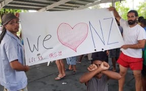 A banner from 104th day of protest on Manus Island