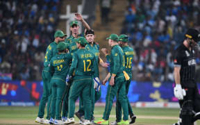 South Africa's Gerald Coetzee celebrates the wicket of New Zealand's Will Young.