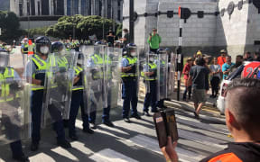 Police with shields on Bowen Street in Wellington.