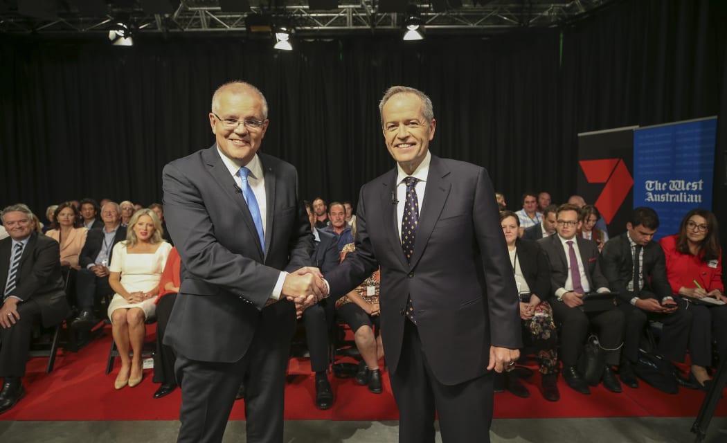 Australia's Prime Minister Scott Morrison (L) and opposition leader Bill Shorten shake hands before the first televised leaders debate in Perth.
