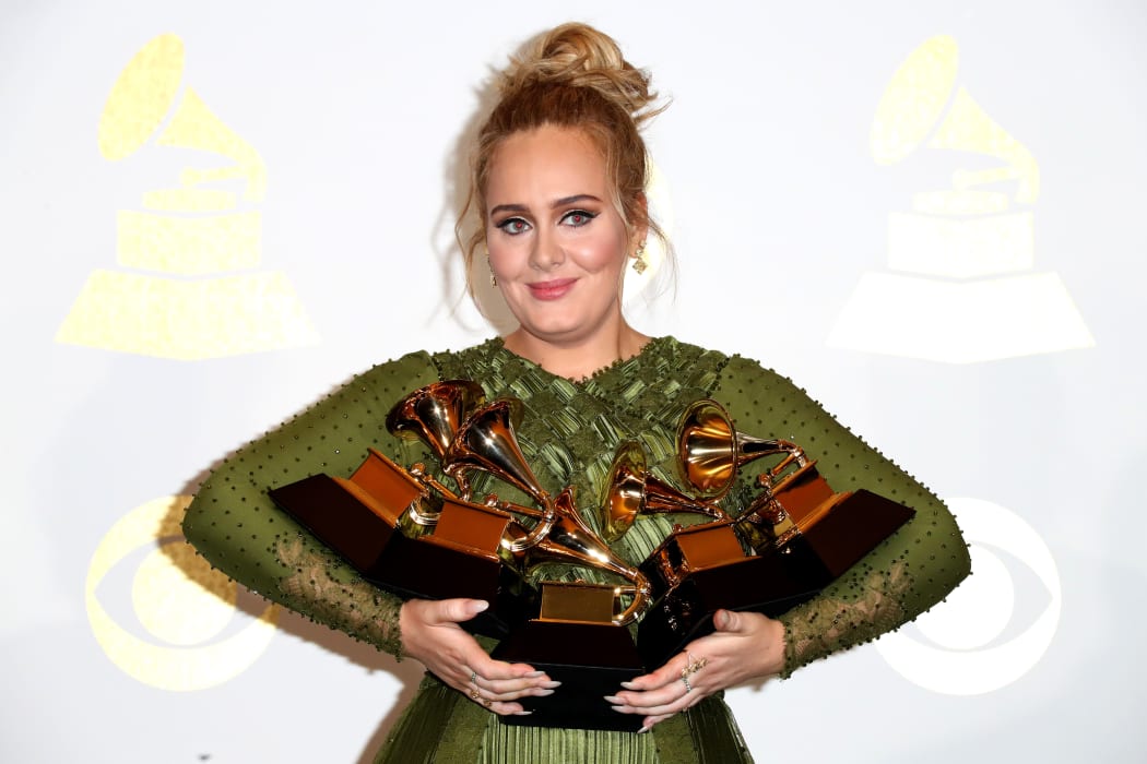 Adele, winner of Album Of The Year and Best Pop Vocal Album and Song Of The Year, Record Of The Year and Best Pop Solo Performance.