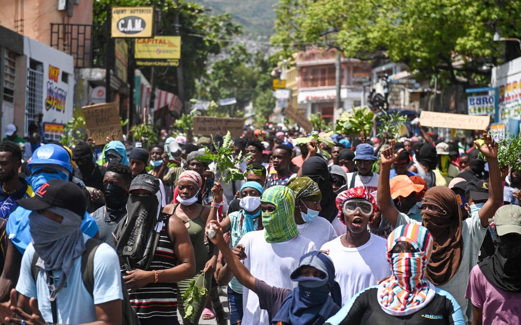 People demonstrate against insecurity in Carrefour-Feuilles, a district of Port-au-Prince, Haiti, on August 14, 2023.