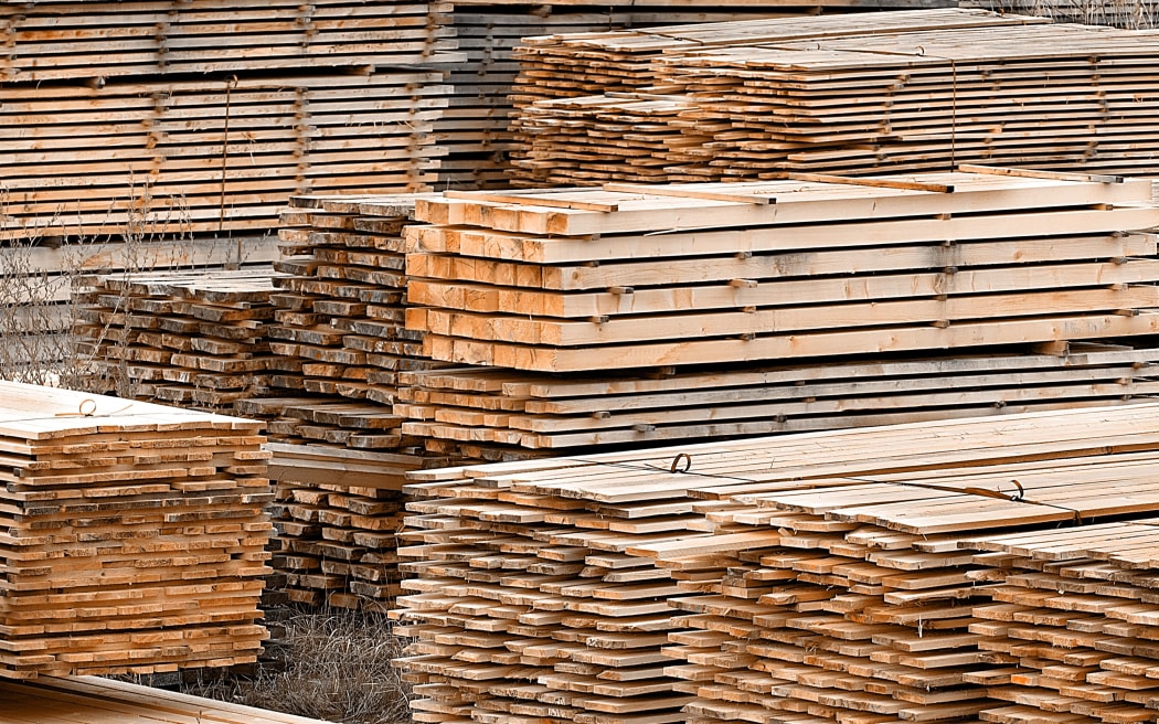 Stacked wood spruce and pine timber for construction buildings