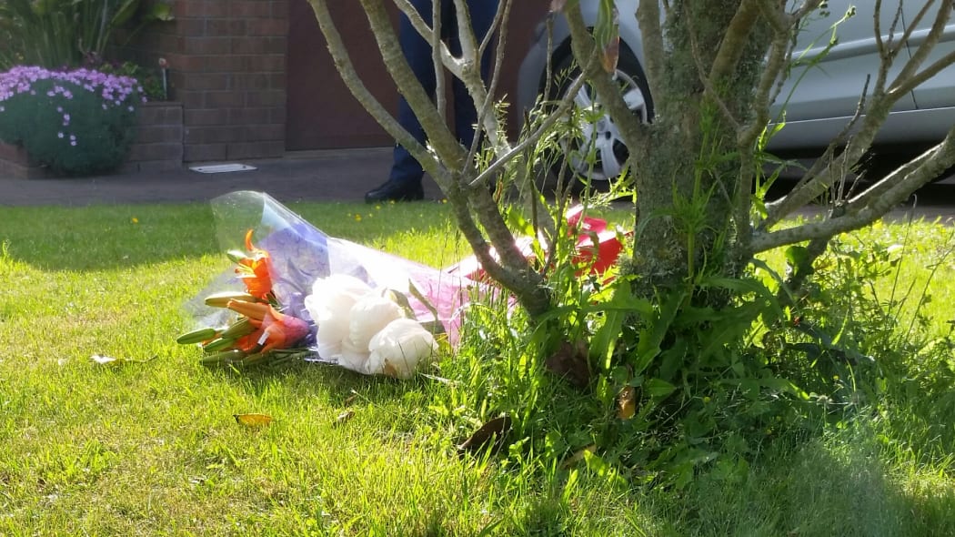 Flowers left at the scene of a death in Churton Park. Police have launched a homocide inquiry.