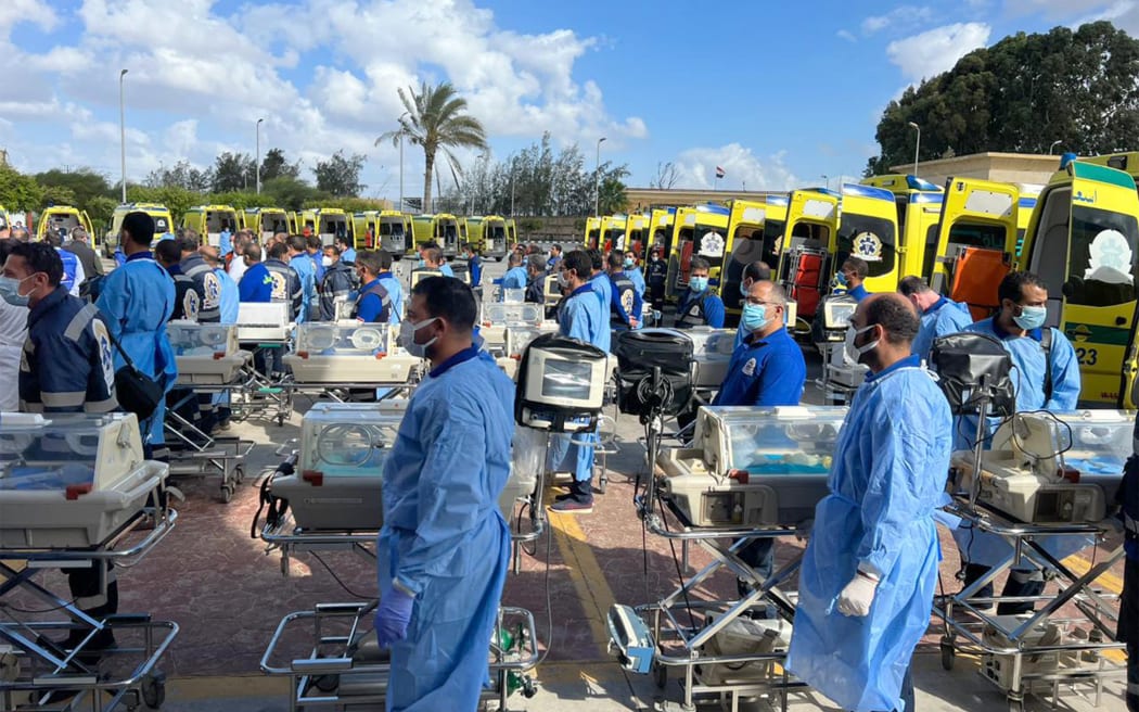 Egyptian medics stand by with incubators near the Rafah border to receive premature Palestinian babies evacuated from Gaza on 20 November 2023.