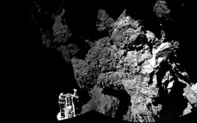 An image from the mission shows the surface of Comet 67P/Churyumov-Gerasimenko - and one of Philae's three feet.