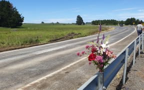 Flowers have been put near where three people died on 1 December, 2020, in a crash on State Highway 2, near Takapau, Hawke's Bay.