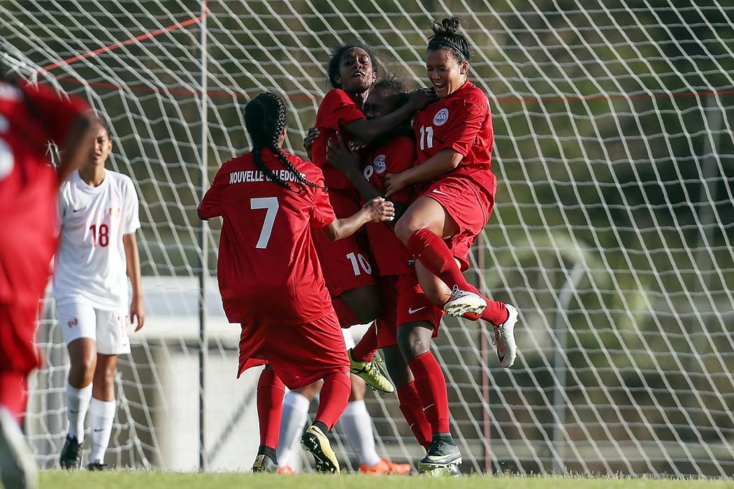 New Caledonia's Kamene Xowie celebrates scoring the opening goal.