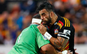 The Chiefs captain Liam Messam is tackled.