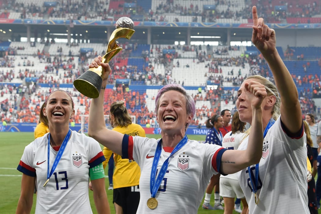 USA's players including forward Megan Rapinoe the World Cup title win.