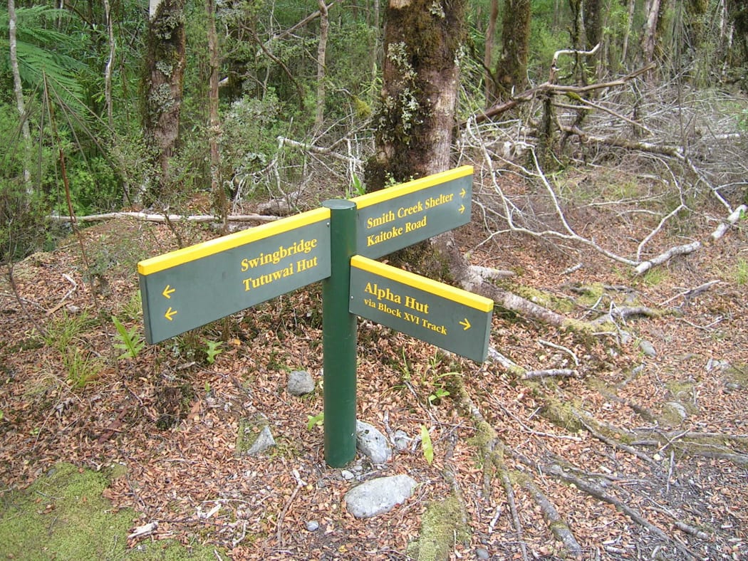 A DOC signs points towards Alpha Hut in Tararua Forest Park