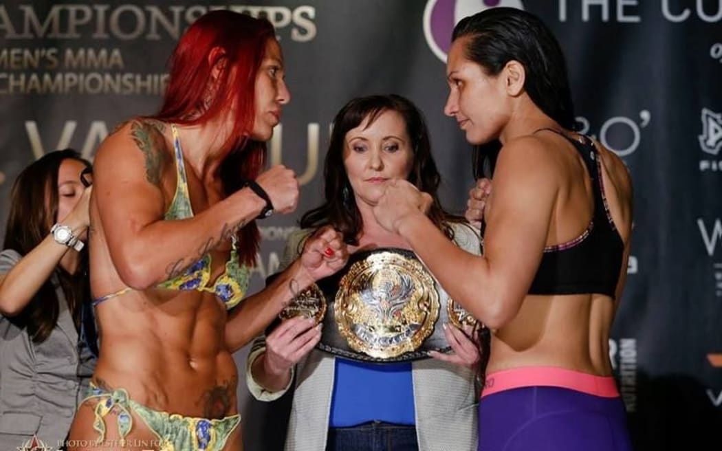 Cris Justino (L) Faith McMah (R) weighing in for Invicta FC title match in 2015