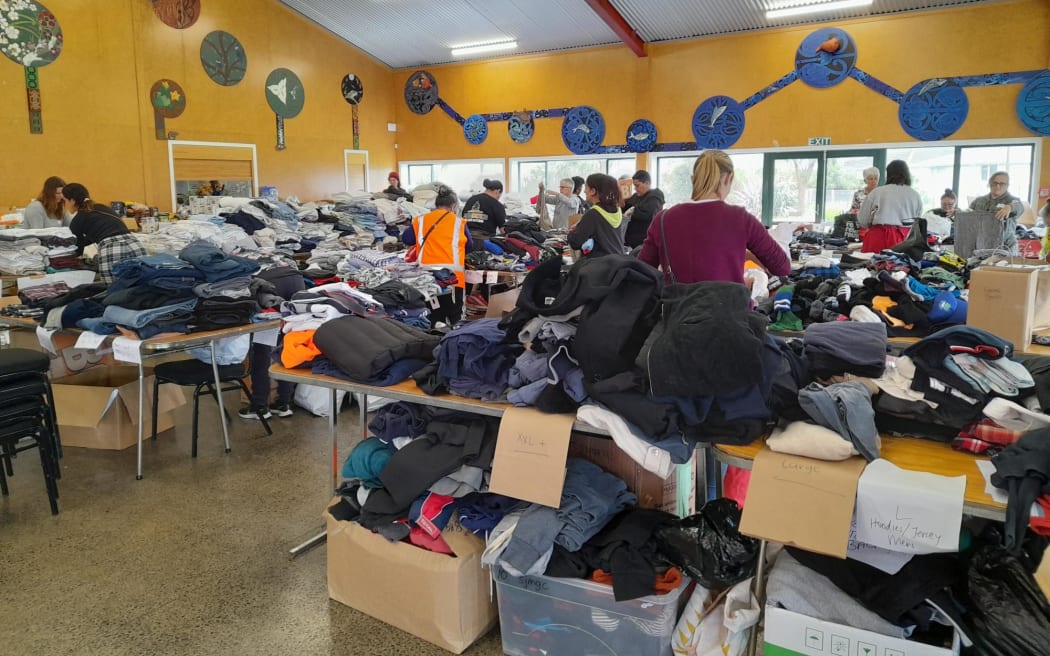 Piles of donated items fill the wharekai at Pukemokimoki marae.