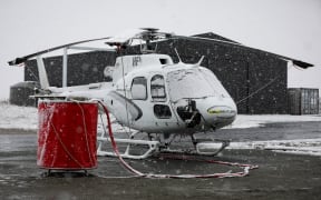 Snow grounds helicopter crews fighting Lake Pukaki fire.