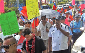 There was a heavy police presence in Apia as about 200 people turned out to protest against land laws.
