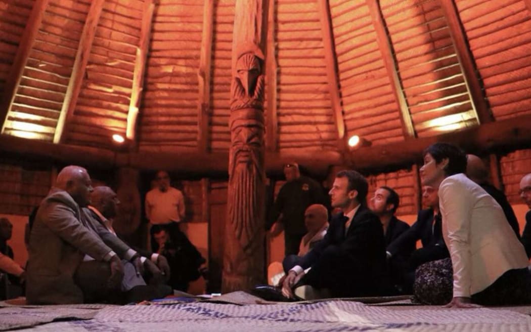 The French president Emmanuel Macron (centre) and overseas minister Annick Girardin (right) meet with Kanak leaders at the customary senate in Noumea, the capital of New Caledonia.