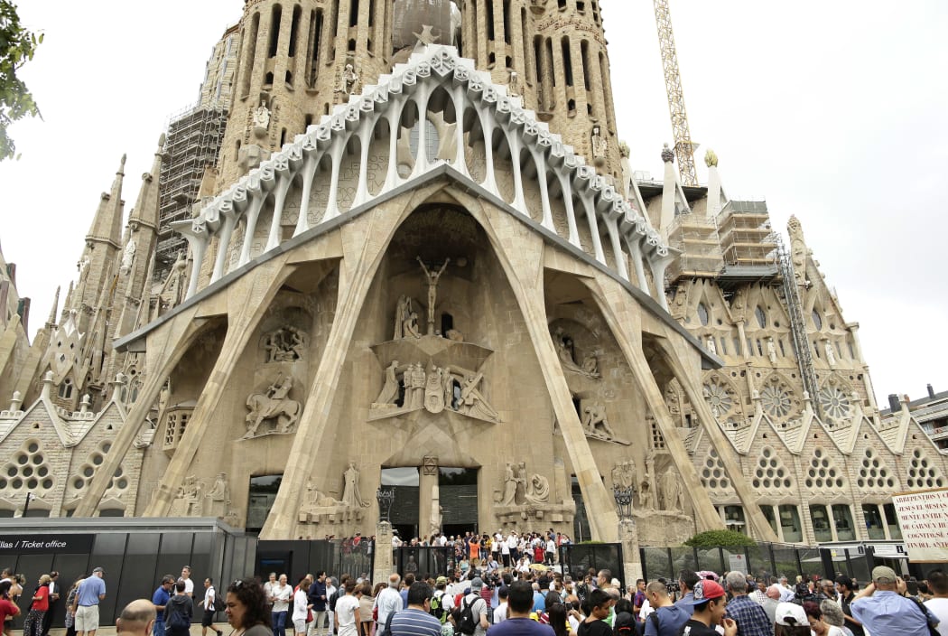 FILE - In this Sunday, Aug. 20, 2017 file photo, dignitaries leave after a Mass at Barcelona's Sagrada Familia Basilica for the victims of the terror attacks, in Barcelona, Spain.