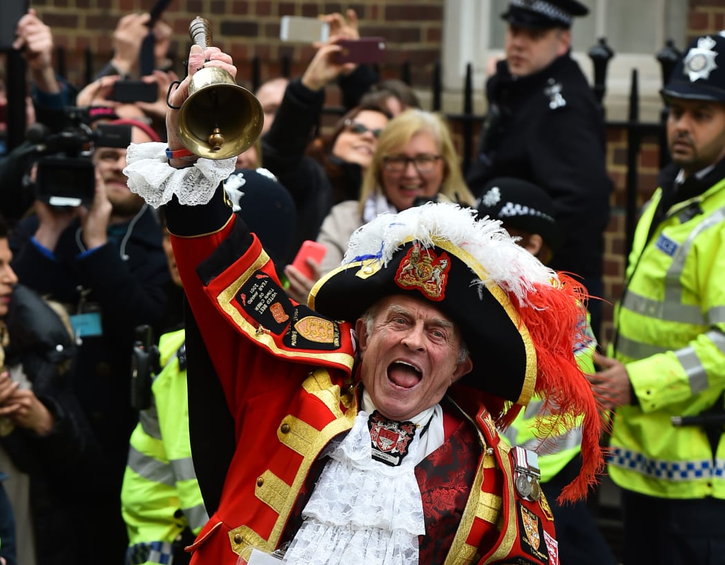 Town crier Tony Appleton makes the announment of the birth.