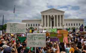 People protest in response to the Dobbs v Jackson Women's Health Organization ruling in front of the U.S. Supreme Court, after the decision overturned the landmark 50-year-old Roe v Wade case, erasing a federal right to an abortion.