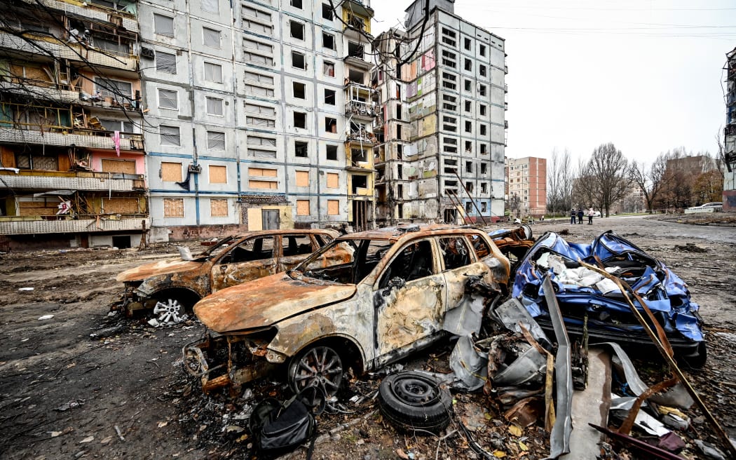 Crashed cars are left outside an apartment building destroyed in the shelling of Russian troops, Zaporizhzhia, southeastern Ukraine.