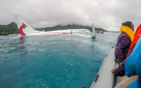 The Air Niugini plane after it crashed into the sea short of the runway at Chuuk, in Federated States of Micronesia.