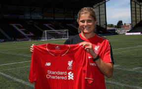 Rosie White shows off her new Liverpool jersey