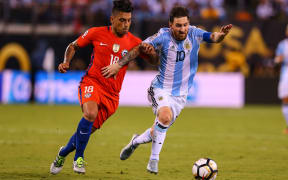 Argentina midfielder Lionel Messi (10) battles Chile defender Gonzalo Jara (18) during the second half of the Copa America Centenario Final between Argentina and Chile