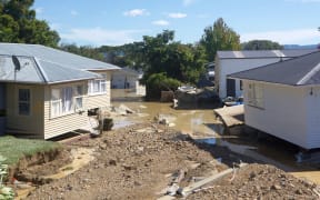 Severely damaged houses in Edgecumbe, after floodwaters tore through the Bay of Plenty town.