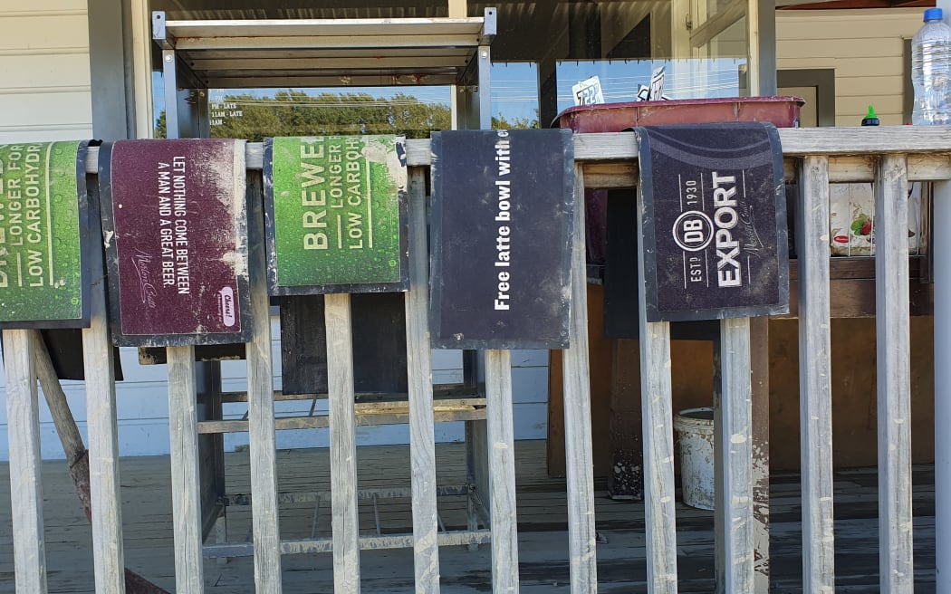 Beer mats hung outside the Tinui pub Wairarapa, during the clean-up post Cyclone Gabrielle