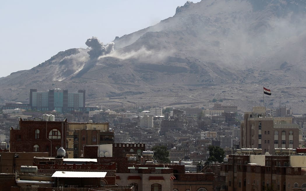 Smoke billows following an air-strike by the Saudi-led coalition targeting an arms depot on the Nuqom mountain overlooking in the Yemeni capital Sanaa.