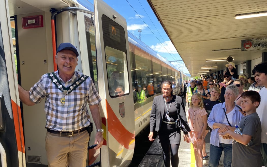 Ruapehu mayor Weston Kirton is welcomed off the Northern Explorer by a large crowd happy to see the return of Taumarunui as a scheduled stop.