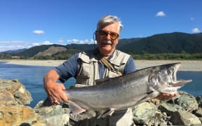 Alex Kole, pictured, landed a quinnat or chinook salmon after help from a passing Marlborough District Council reserves ranger.