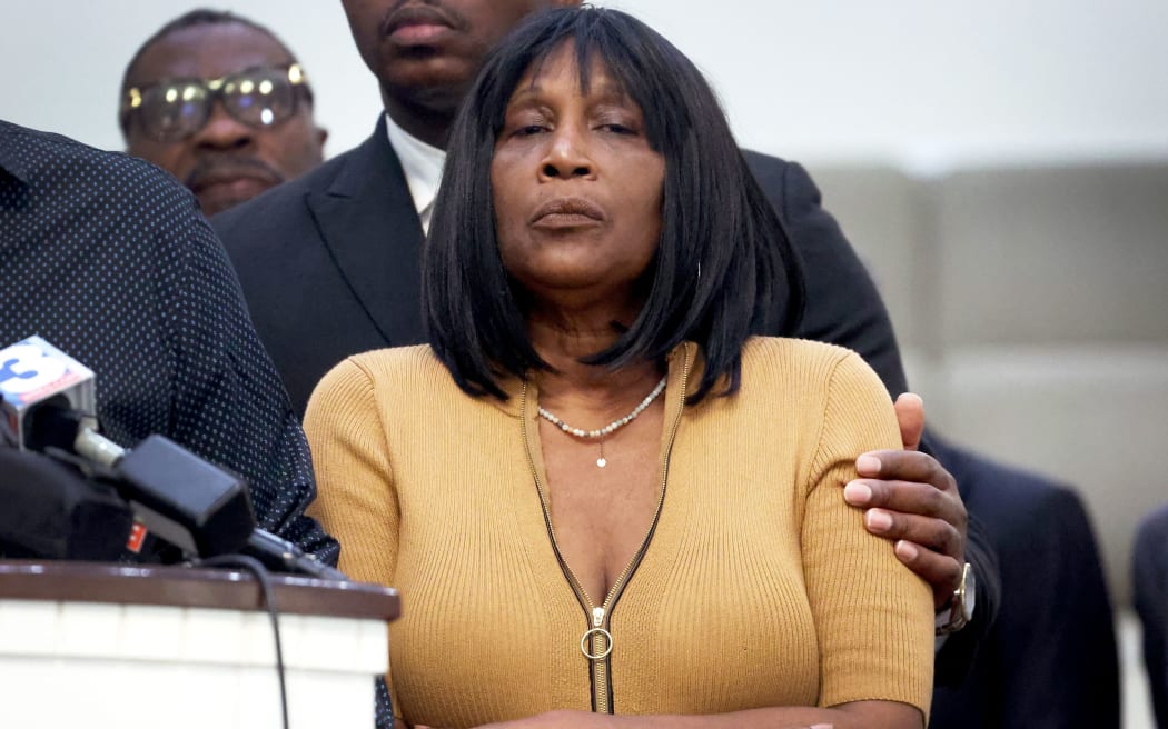 MEMPHIS, TENNESSEE - JANUARY 27: RowVaughn Wells, mother of Tyre Nichols, is comforted during a press conference on January 27, 2023 in Memphis, Tennessee. Tyre Nichols, a 29-year-old Black man, died three days after being severely beaten by five Memphis Police Department officers during a traffic stop on January 7, 2023. Memphis and cities across the country are bracing for potential unrest when the city releases video footage from the beating to the public later this evening.   Scott Olson/Getty Images/AFP (Photo by SCOTT OLSON / GETTY IMAGES NORTH AMERICA / Getty Images via AFP)