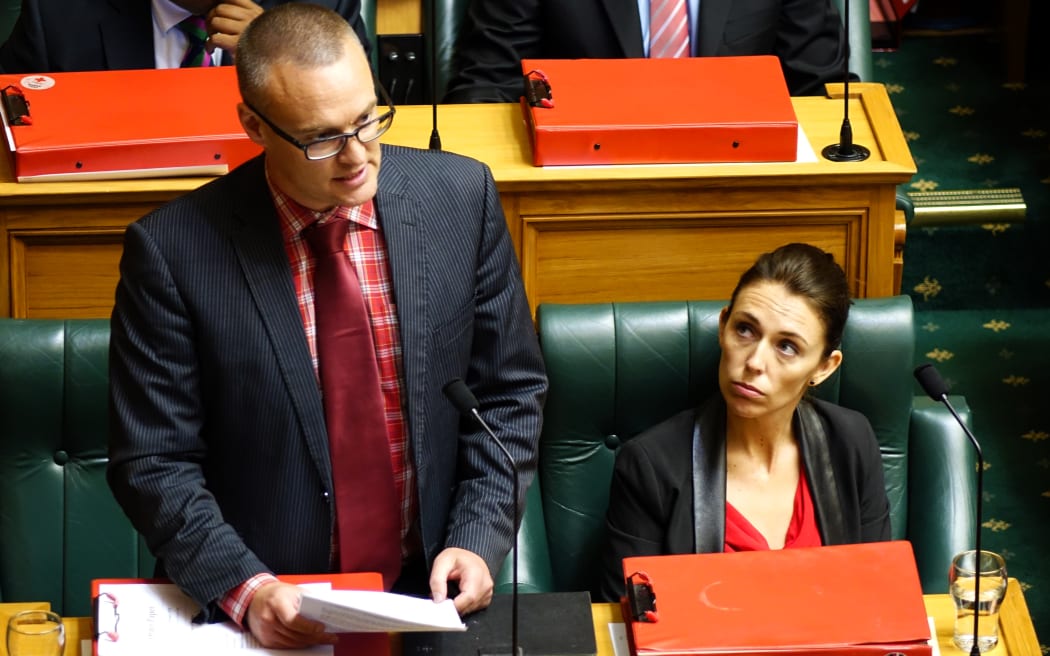 Labour MP Dr David Clark (left) and Labour MP Jacinda Ardern (right) in question time.