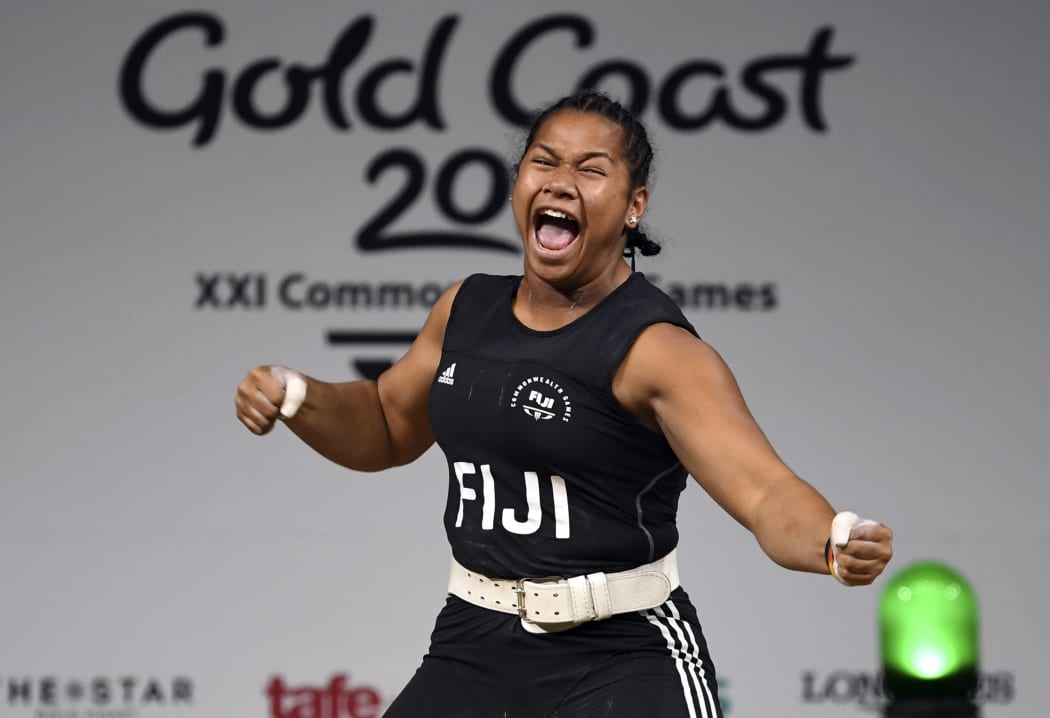 Eileen Cikamatana celebrates on her way to winning gold in the women's 90kg weightlifting final at the 2018 Gold Coast Commonwealth Games.