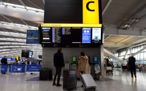 Travellers at an almost deserted departures hall at Terminal 5 of Heathrow Airport in west London on December 21, 2020, as a string of countries around the world banned travellers arriving from the UK.