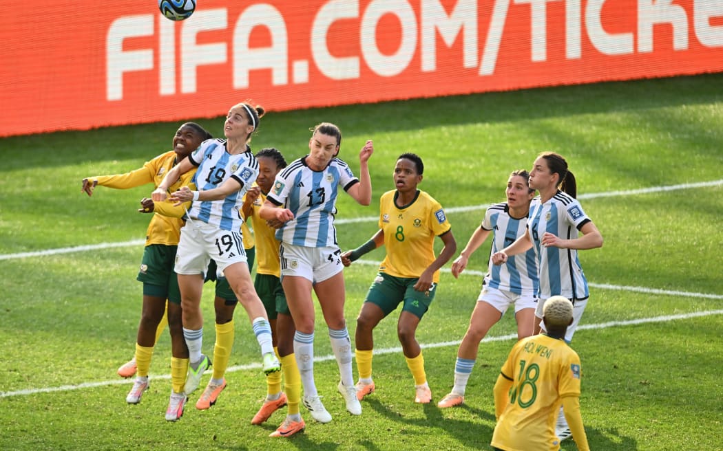 Argentina and South Africa contest possession in their FIFA World Cup group game.