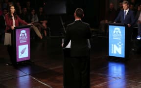 Jacinda Ardern and Bill English during the second leaders debate, hosted by Patrick Gower (centre).