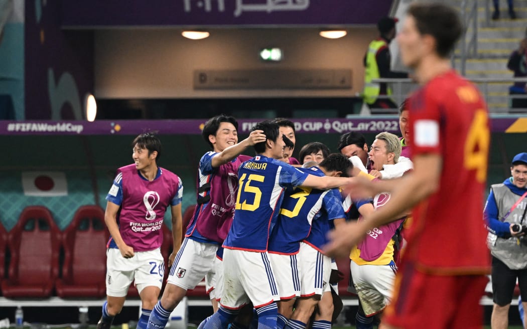 Members of Japan celebrate after scoring in the second half of the FIFA World Cup Group E match Japan vs Spain at Khalifa International Stadium in Ar-Rayyan, Qatar on 1 December, 2022.