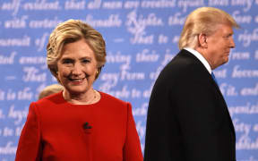 Hillary Clinton and Donald Trump leave the stage after the first presidential debate.