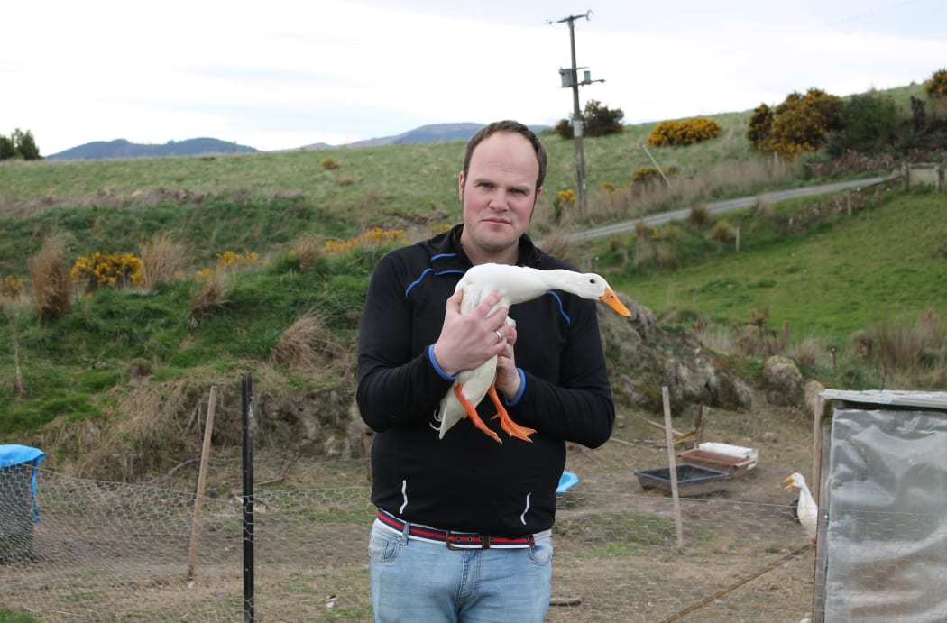 Richard Price with a Pekin duck