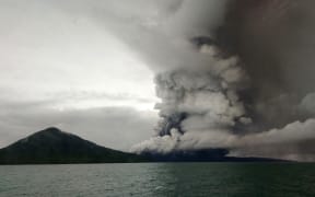 Anak (Child) Krakatoa volcano erupting, as seen from a ship on the Sunda Straits on 26 December.