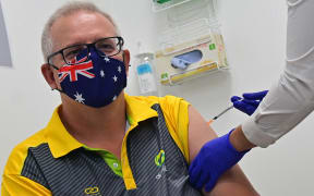 Australia's Prime Minister Scott Morrison receives a dose of the Pfizer/BioNTech Covid-19 vaccine.